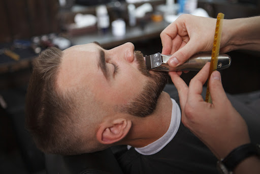 barber giving a client a shave